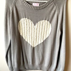 Never worn. Light great with white knitted heart sweater